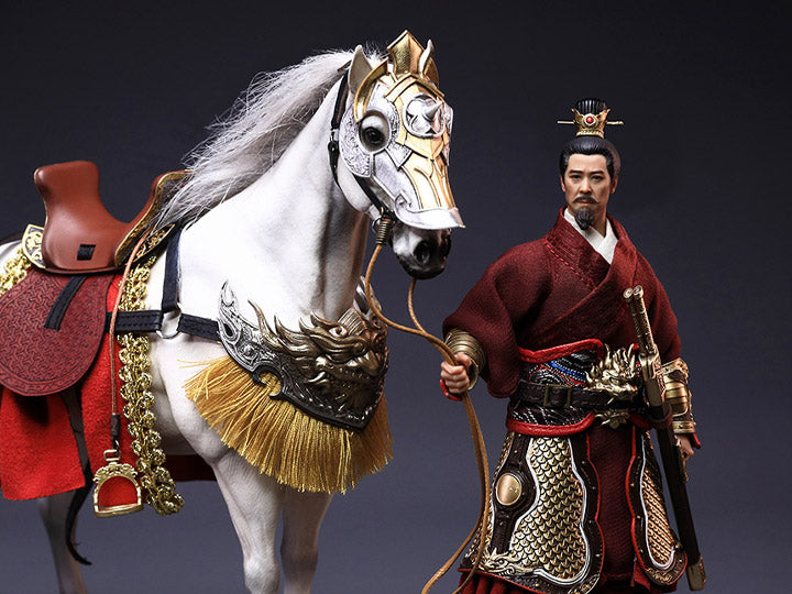 Crush the invading enemies as you defend your homeland with this Liu Bei Xuande figure by 303 Toys! Featuring multiple weapons and accessories, this 1/12 scale figure will be a perfect addition for any collector. Order yours today! The Battlefield Version of this figure includes a war banner and horse for your warrior to ride on.