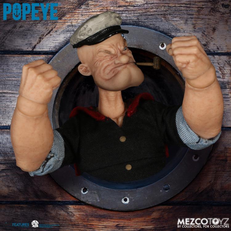 The One:12 Collective Popeye figure includes two masterfully crafted head portraits: a stern stare and a salty glare. Authentically presented in his classic sailor clothing and a removable pea coat, Popeye comes complete with a wide range of accessories including: a functional drawstring duffle bag, a collapsible spy glass, a compass with hinged lid, two spinach cans, three different hats, and two styles of corncob pipes.