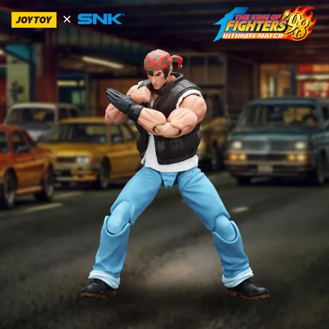 A new fighter is approaching! From the legendary fighting game The King of Fighters '98: Ultimate Match comes the next challenger in 1/18 scale: Ralf Jones! Dressed in his traditional biker outfit, Ralf comes with a large variety of accessories including effect pieces when he executes a powerful move. Recreated with outstanding detail lifted directly from the game, you'll be able to re-enact your favorite brawls or envision your own high stakes fights in style!