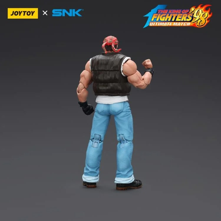 A new fighter is approaching! From the legendary fighting game The King of Fighters '98: Ultimate Match comes the next challenger in 1/18 scale: Ralf Jones! Dressed in his traditional biker outfit, Ralf comes with a large variety of accessories including effect pieces when he executes a powerful move. Recreated with outstanding detail lifted directly from the game, you'll be able to re-enact your favorite brawls or envision your own high stakes fights in style!