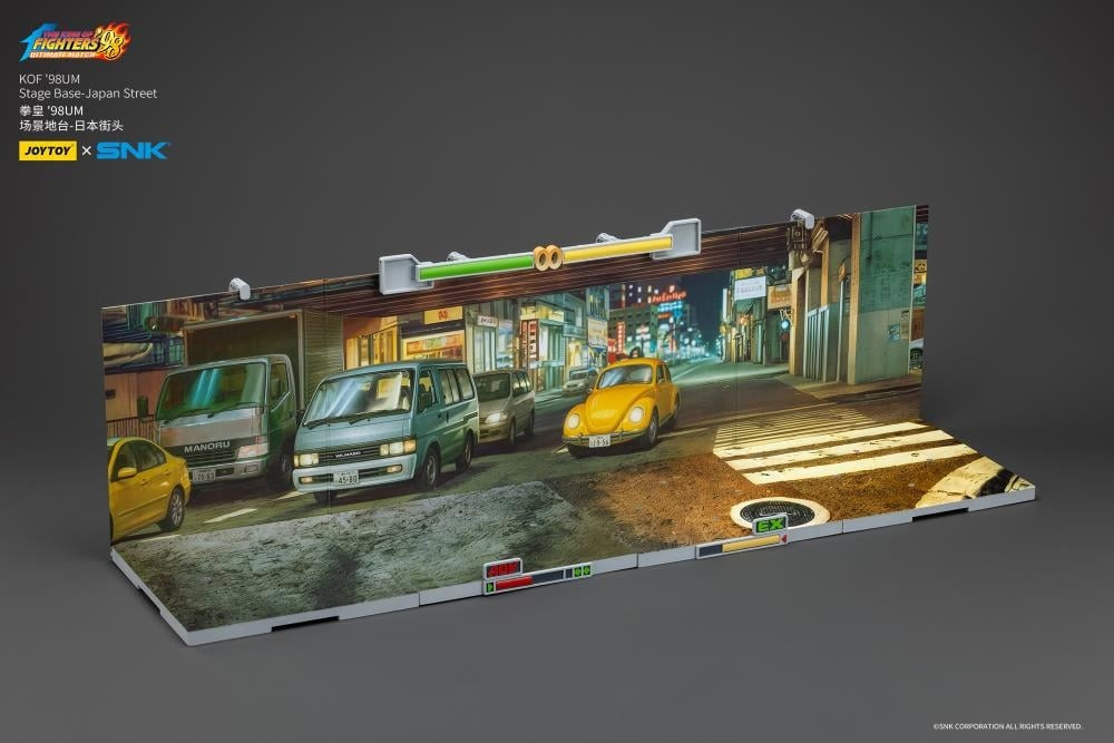 A new fighter is approaching! From the legendary fighting game The King of Fighters '98: Ultimate Match comes a new way to display your favorite heroes and villains duking it out for prizes and glory: the Japan Stage! A diorama base that showcases a busy night street in the middle of a Japanese city, this stage features impressive detailing lifted directly from the game! Get ready for the next round when you order your diorama base today!