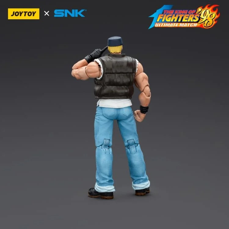A new fighter is approaching! From the legendary fighting game The King of Fighters '98: Ultimate Match comes the next challenger in 1/18 scale: Clark Still! Dressed in his traditional black and white outfit, Clark comes with a large variety of accessories including effect pieces when he executes a powerful move. Recreated with outstanding detail lifted directly from the game, you'll be able to re-enact your favorite brawls or envision your own high stakes fights in style!