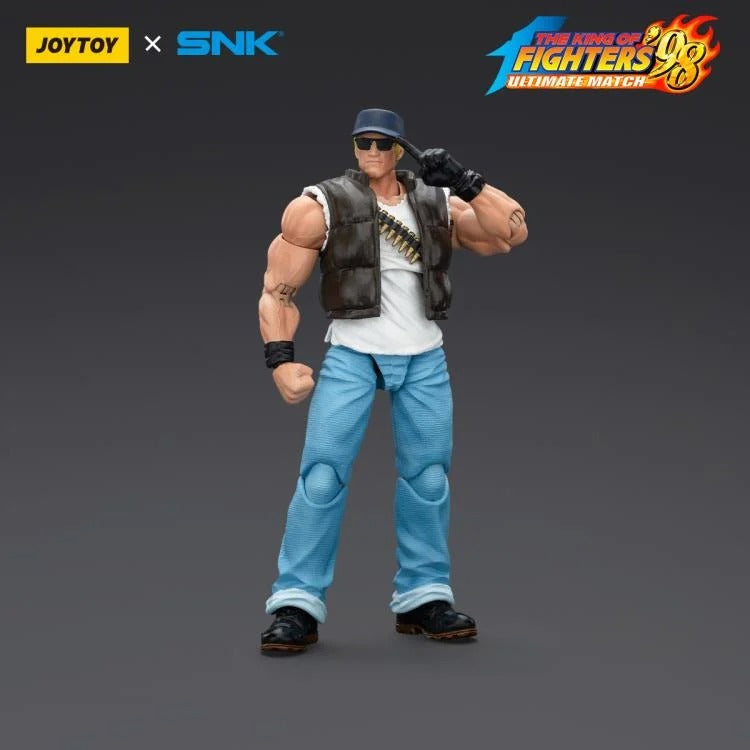 A new fighter is approaching! From the legendary fighting game The King of Fighters '98: Ultimate Match comes the next challenger in 1/18 scale: Clark Still! Dressed in his traditional black and white outfit, Clark comes with a large variety of accessories including effect pieces when he executes a powerful move. Recreated with outstanding detail lifted directly from the game, you'll be able to re-enact your favorite brawls or envision your own high stakes fights in style!