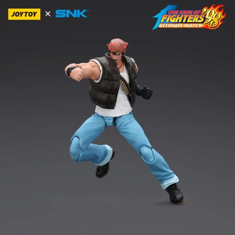 A new fighter is approaching! From the legendary fighting game The King of Fighters '98: Ultimate Match comes the next challenger in 1/18 scale: Ralf Jones! Dressed in his traditional biker outfit, Ralf comes with a large variety of accessories including effect pieces when he executes a powerful move. Recreated with outstanding detail lifted directly from the game, you'll be able to re-enact your favorite brawls or envision your own high stakes fights in style!