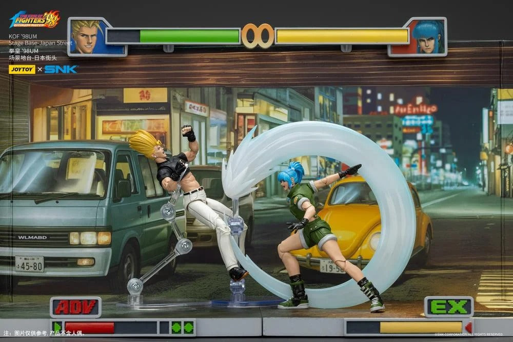 A new fighter is approaching! From the legendary fighting game The King of Fighters '98: Ultimate Match comes a new way to display your favorite heroes and villains duking it out for prizes and glory: the Japan Stage! A diorama base that showcases a busy night street in the middle of a Japanese city, this stage features impressive detailing lifted directly from the game! Get ready for the next round when you order your diorama base today!