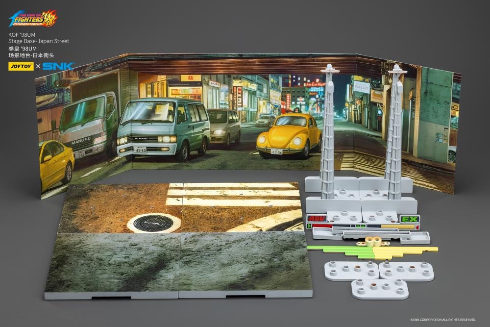 A new fighter is approaching! From the legendary fighting game The King of Fighters '98: Ultimate Match comes a new way to display your favorite heroes and villains duking it out for prizes and glory: the Japan Stage! A diorama base that showcases a busy night street in the middle of a Japanese city, this stage features impressive detailing lifted directly from the game! Get ready for the next round when you order your diorama base today!