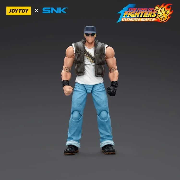 A new fighter is approaching! From the legendary fighting game The King of Fighters '98: Ultimate Match comes the next challenger in 1/18 scale: Clark Still! Dressed in his traditional black and white outfit, Clark comes with a large variety of accessories including effect pieces when he executes a powerful move. Recreated with outstanding detail lifted directly from the game, you'll be able to re-enact your favorite brawls or envision your own high stakes fights in style!