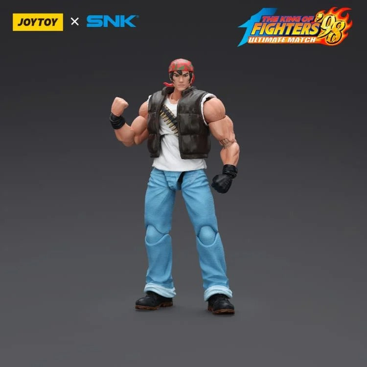 A new fighter is approaching! From the legendary fighting game The King of Fighters '98: Ultimate Match comes the next challenger in 1/18 scale: Ralf Jones! Dressed in his traditional biker outfit, Ralf comes with a large variety of accessories including effect pieces when he executes a powerful move. Recreated with outstanding detail lifted directly from the game, you'll be able to re-enact your favorite brawls or envision your own high stakes fights in style!