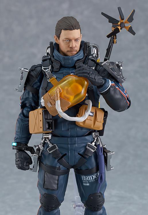Supervised entirely by Kojima Productions, the popular game Death Stranding releases the deluxe version of the Sam Porter Bridges figma!  The smooth yet poseable joints of figma figures allow them to be posed on their included articulated stand. 3D paintwork has been utilized to realistically recreate Sam's face. He comes with a small cargo case, an assault rifle, damage sensor tape, and cargo ID stickers that can be applied as desired.
