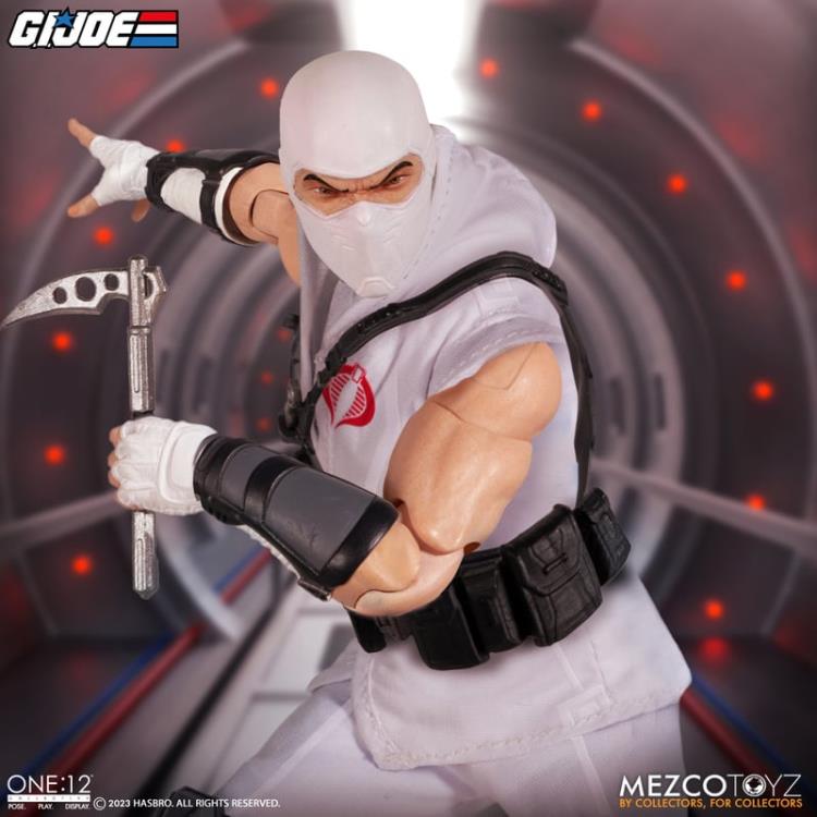 Enter Storm Shadow, Cobra Commander’s ninja bodyguard and latest addition to the One:12 Collective! The One:12 Collective Storm Shadow is outfitted in a short-sleeved karategi with Cobra insignia, shin guards, and tabi boots. His chest harness can hold 3 kunai in the front and his quiver in the back, and his thigh sheath can hold his nunchaku. Storm Shadow comes complete with two masked head portraits with different facial expressions, and 1 unmasked portrait.