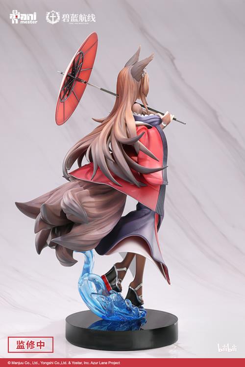 From the popular mobile game Azur Lane comes a figure of the battlecruiser, Amagi. Amagi appears in her purple and red outfit and a bright red coat and is holding an umbrella. This version removes her ship parts, focusing more on her flowing hair, coat and skirt. A great addition for any Azur Lane fan looking to add to their display!