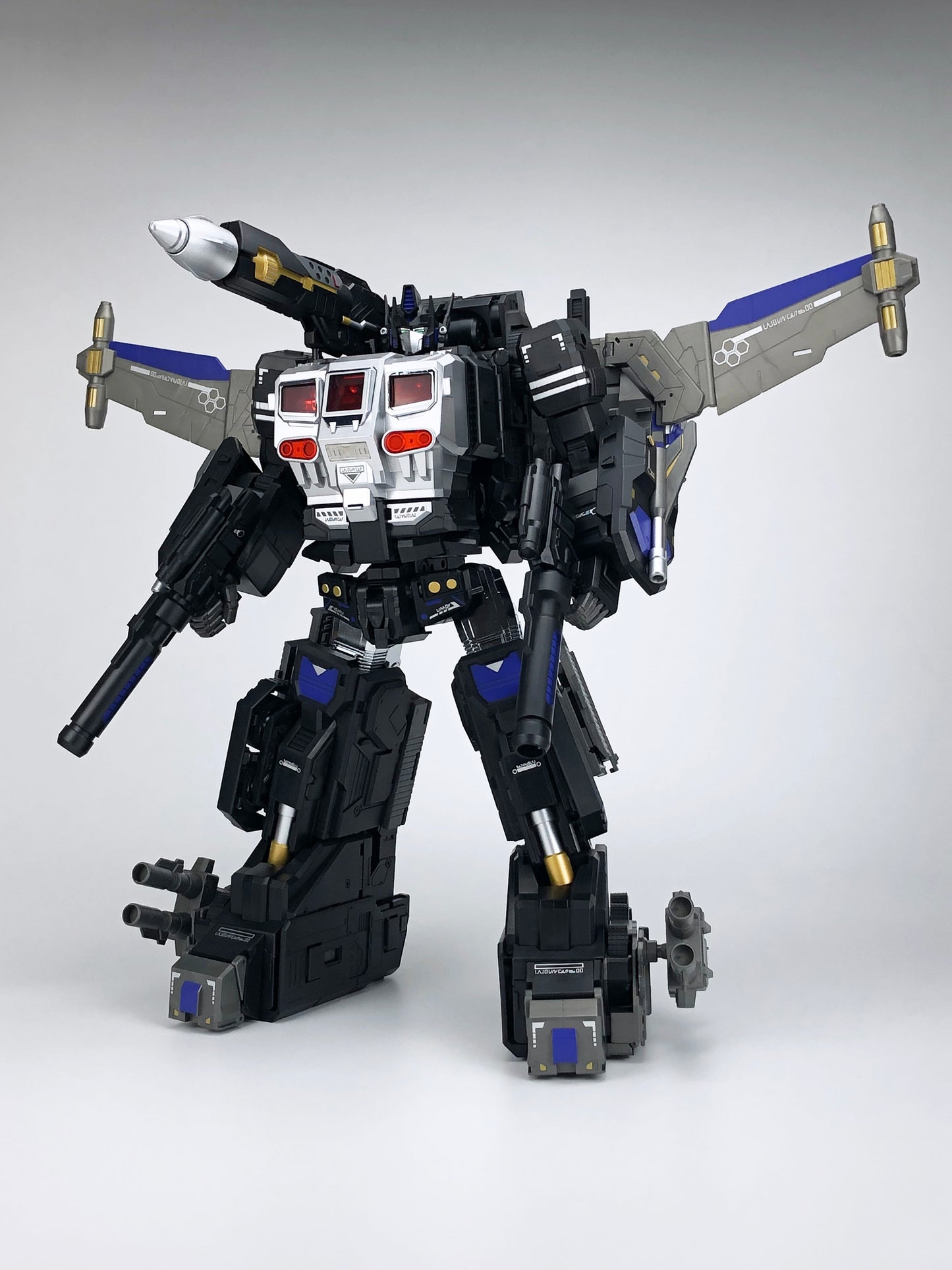 Fans Hobby presents the MB-011A Black God Armor as part of the Master Builder series!  This transforming figure converts from robot mode to trailer mode and back again. Black God Armor can be combined with the Master Builder MB-06A Black Power Baser figure (sold separately).